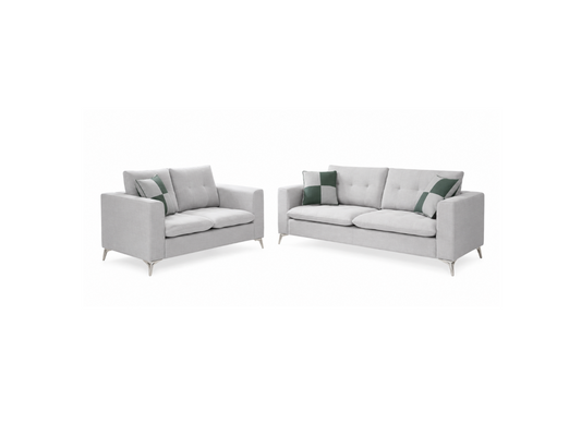 A light gray upholstered loveseat and matching sofa set with slim silver legs and green accent pillows, shown on a plain white background.