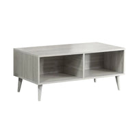 Wooden TV stand with two open shelves on a white background