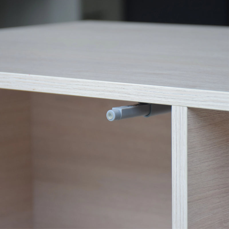 Close-up of a wooden shelf with a metal bracket