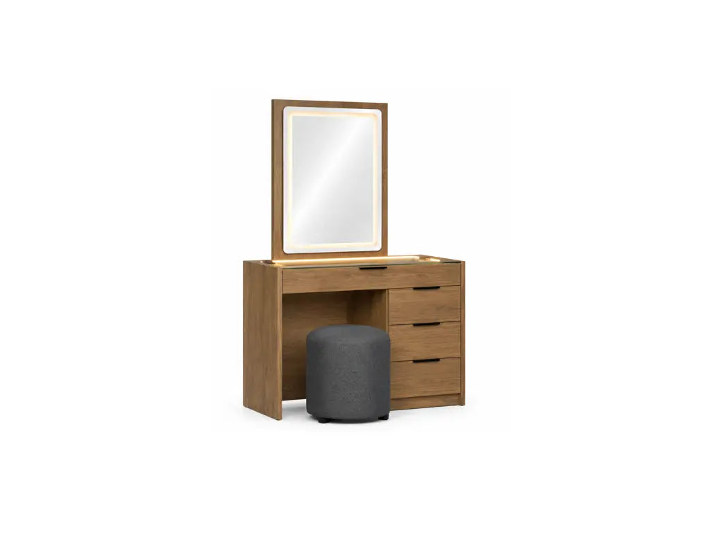 A wooden vanity table with an attached rectangular mirror and three drawers, shown with a dark gray cylindrical stool in front, isolated on a white background.
