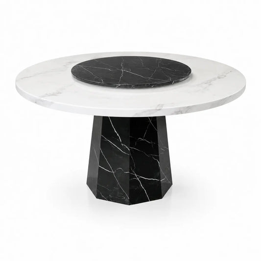 A round dining table with a white marble top, a black marble center platter, and a faceted black marble pedestal base, shown on a white background.