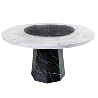 Marble table with white top and black base on a white background