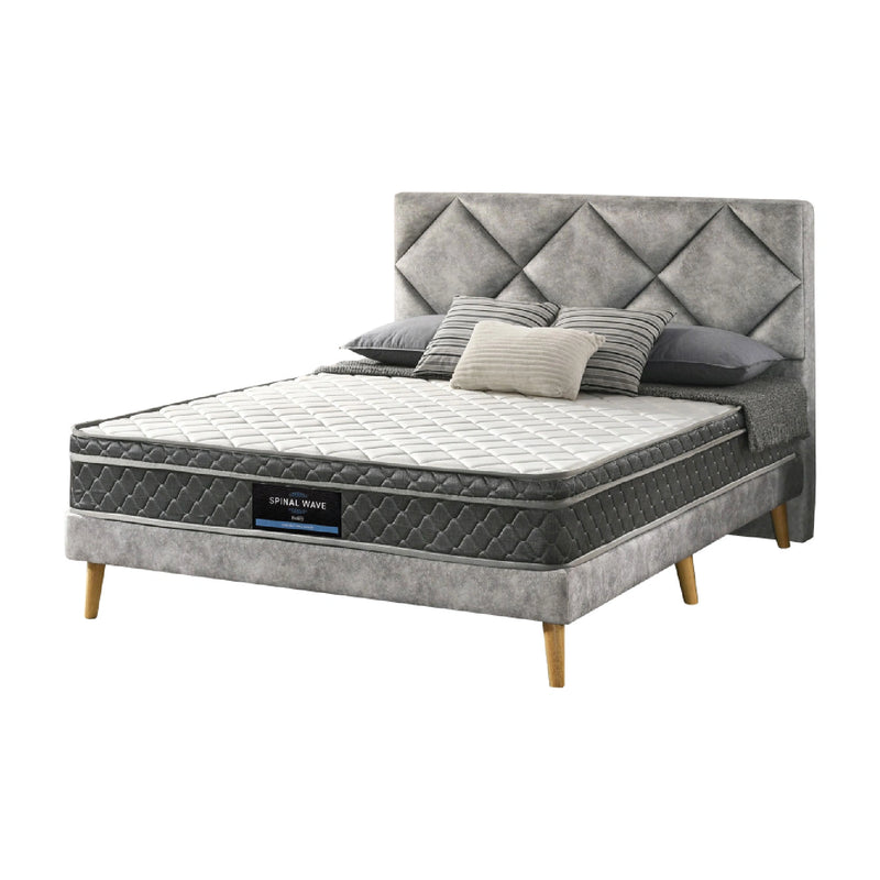 Gray upholstered bed with tufted headboard and mattress on a white background