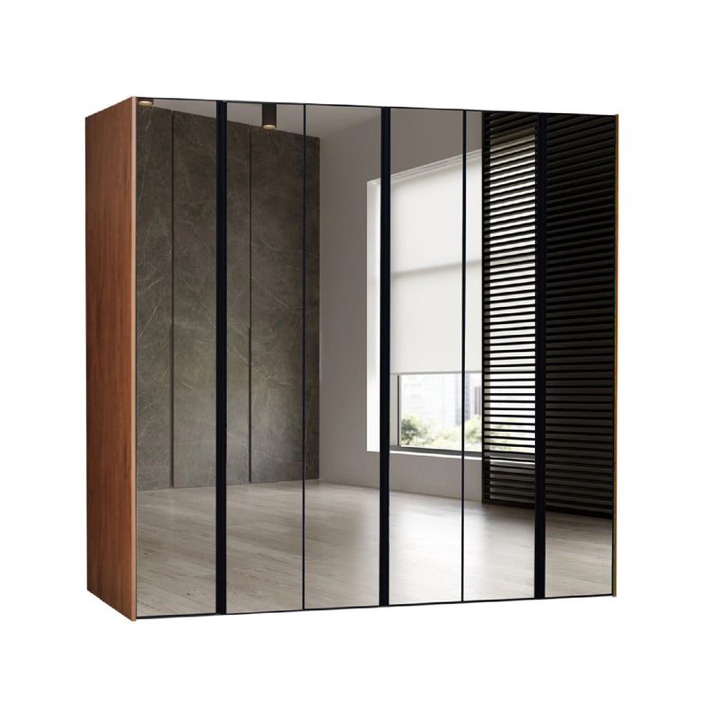 Modern wardrobe with glass doors in a room with a window.