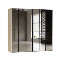 Modern wardrobe with sliding doors in a room with a window.