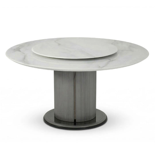 Round marble table with a metallic base on a white background