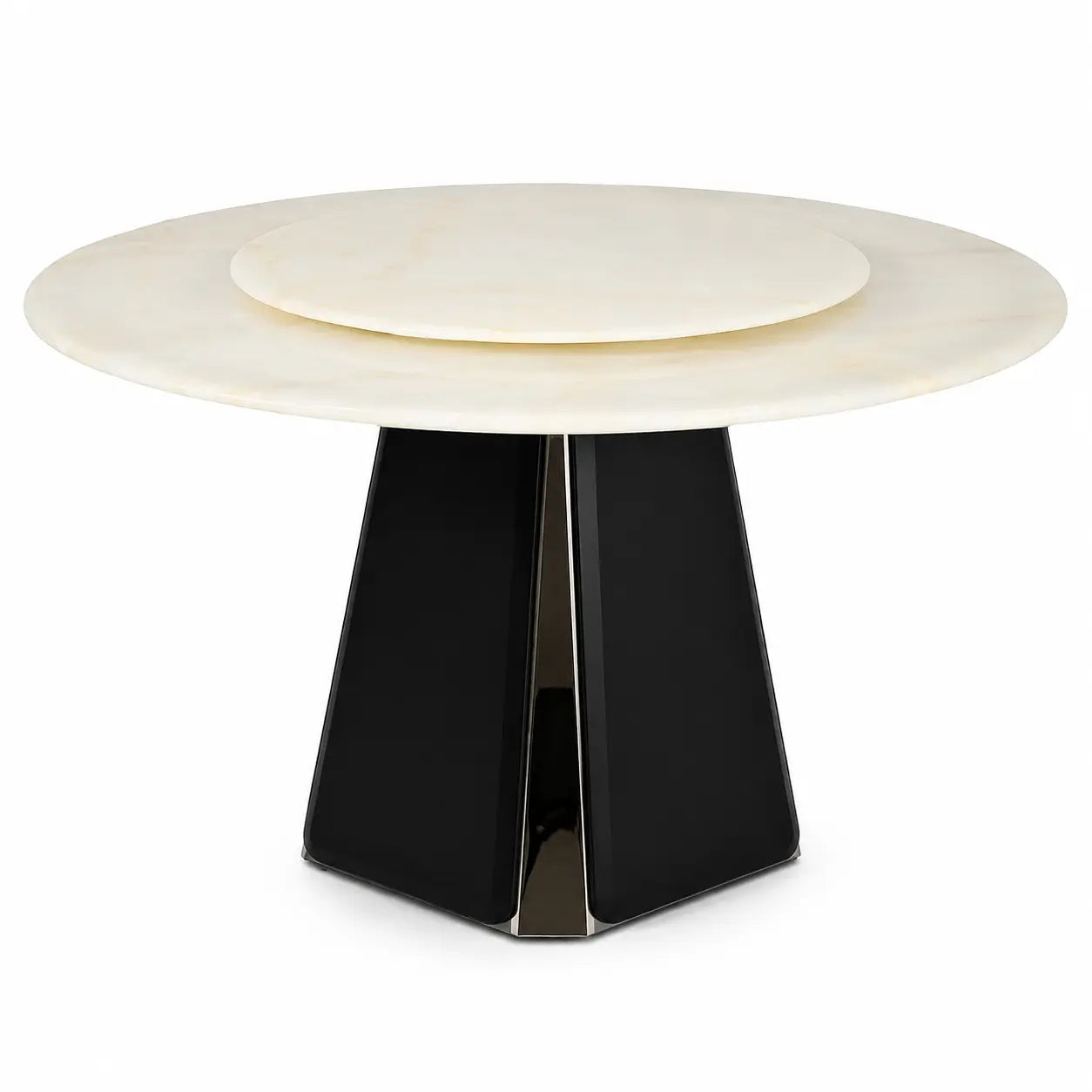 A modern round dining table featuring a cream-colored stone top with a concentric inner ring and a sculptural black faceted pedestal base.