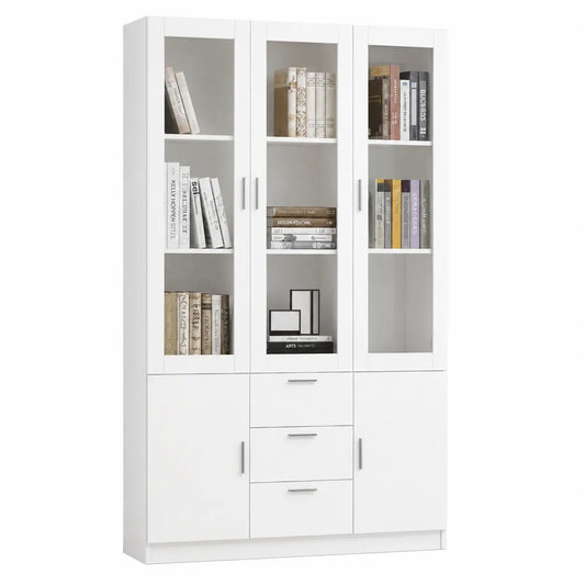A tall white bookcase with three columns of shelving and doors, shown against a plain white background. The bookcase is styled with books and small picture frames.
