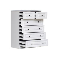 White dresser with multiple drawers on a white background