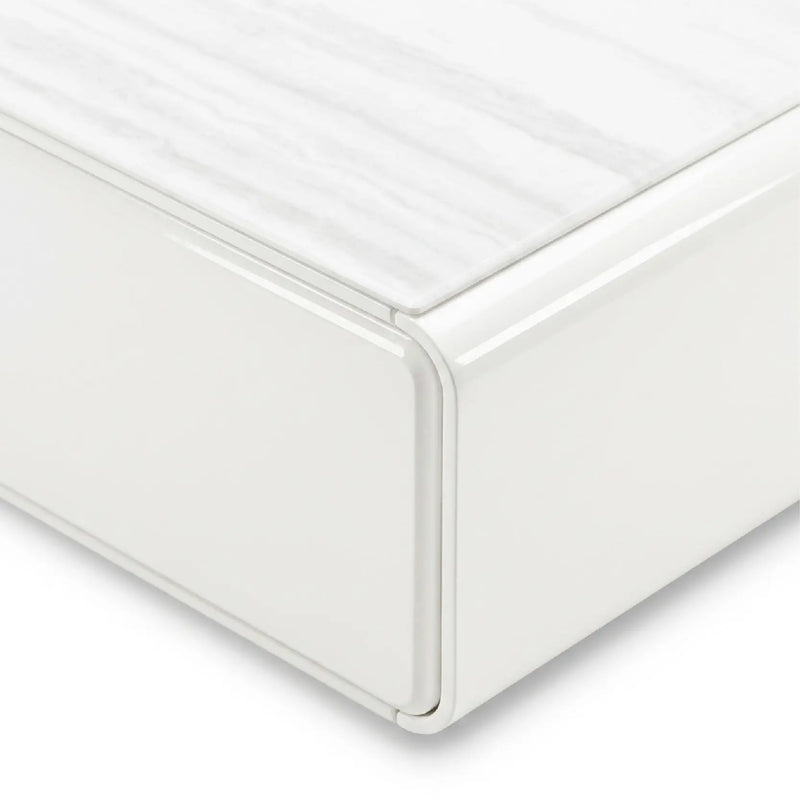Close-up of a white mattress corner with a smooth finish