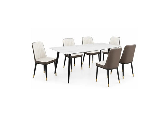 A modern 7-piece dining set featuring a rectangular white marble-top table with black legs, surrounded by six upholstered dining chairs in a mix of beige and taupe-brown fabrics with black legs and gold-toned feet, shown on a solid white background.