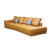 Brown sectional sofa with blue cushions on a white background