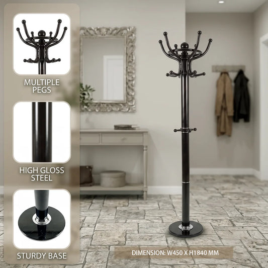 A tall black steel coat rack with multiple curved pegs and a round base, shown in a home entryway setting. An inset panel on the left highlights features: multiple pegs, high gloss steel, and a sturdy base.