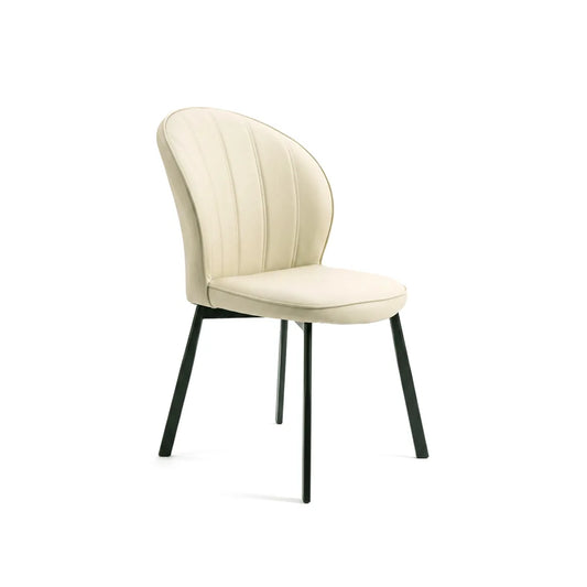 An upholstered dining chair with a curved, vertically channel-tufted cream backrest and a matching cushioned seat, supported by slim black metal legs, shown against a plain white background.