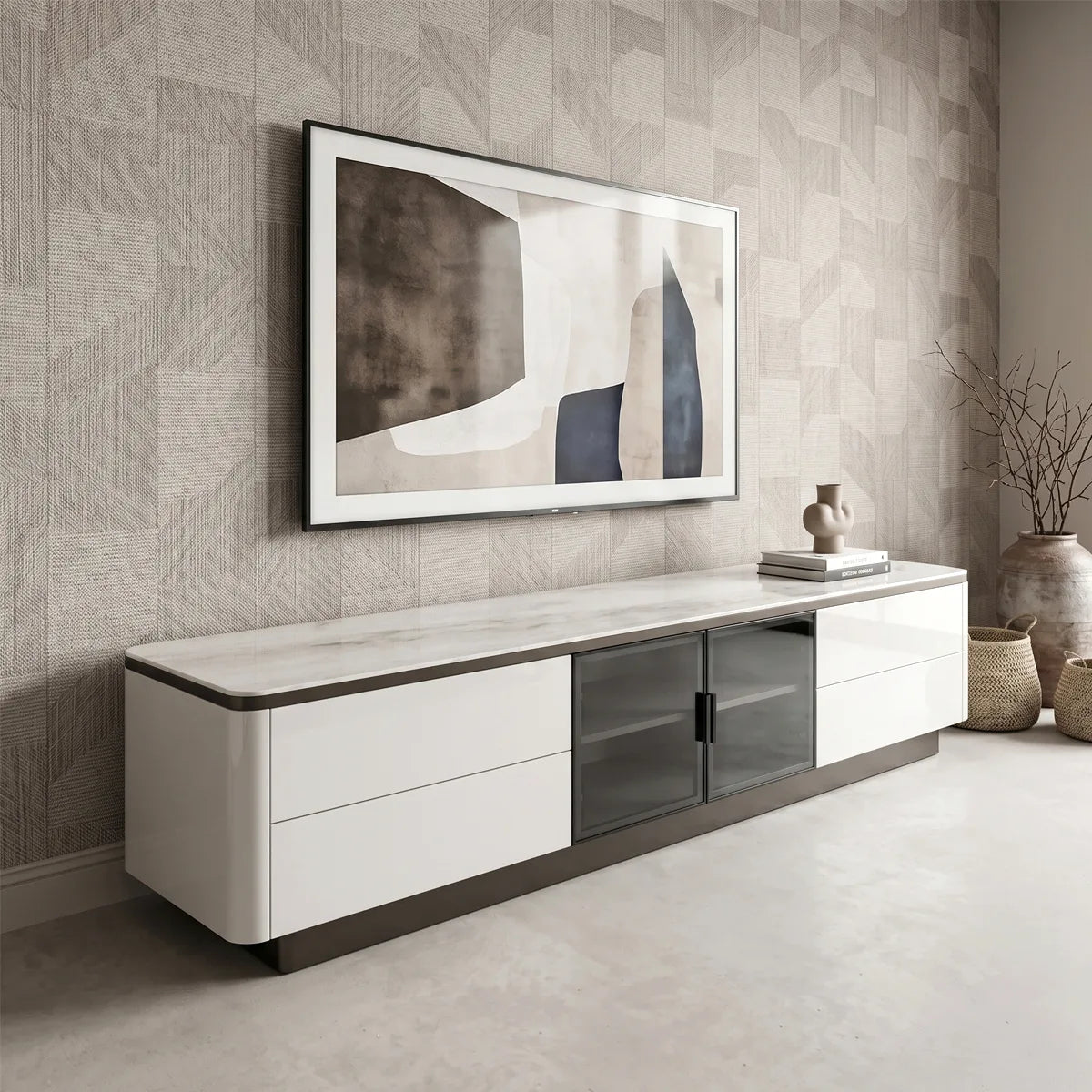Modern living room with a white TV stand, framed abstract art, and decorative items