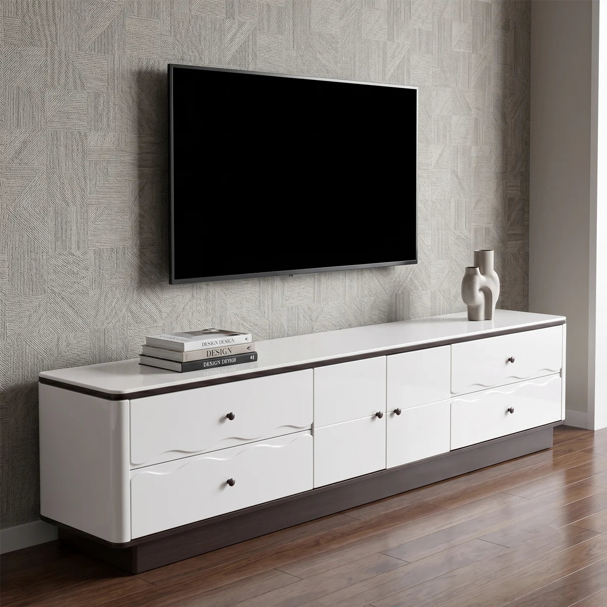 White entertainment console with a television mounted on a patterned wall