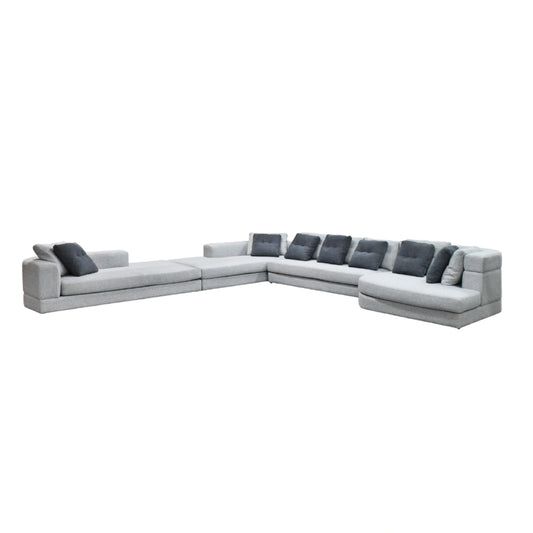 Gray sectional sofa with dark cushions