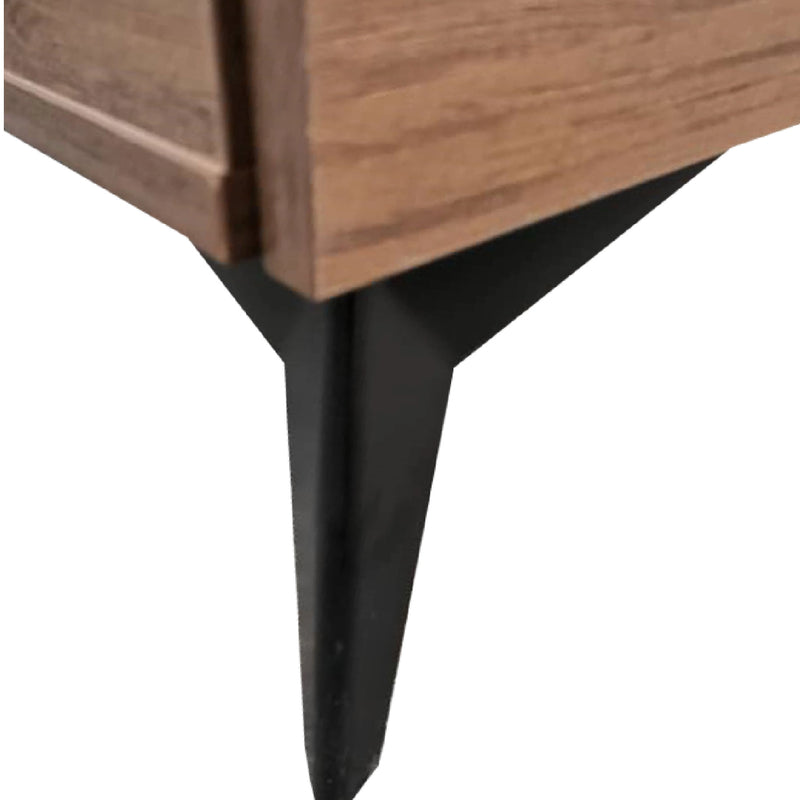 Close-up of a wooden furniture piece with a black metal leg on a white background