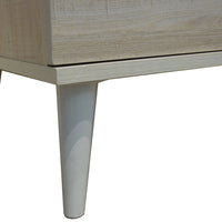 Close-up of a wooden cabinet leg on a white background