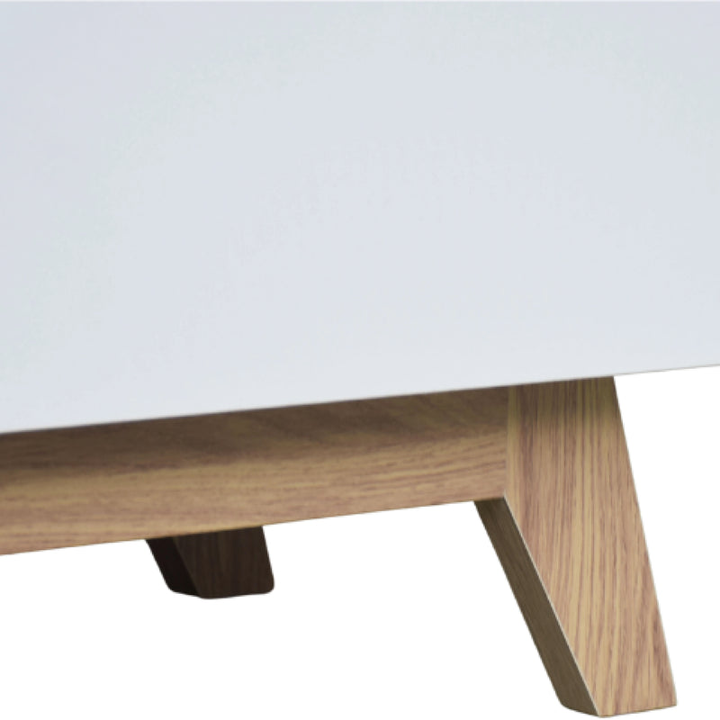 Close-up of a wooden table leg on a white background