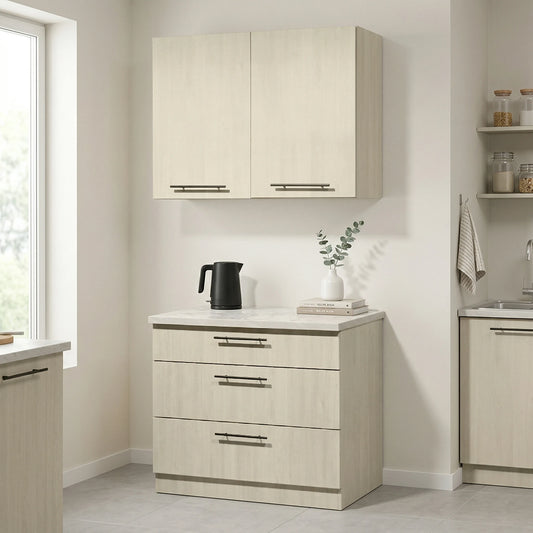 A light beige wood-look kitchen cabinet set in a bright, modern kitchen. The set includes a double-door upper cabinet and a three-drawer lower cabinet with matching drawer fronts and slim horizontal bar handles
