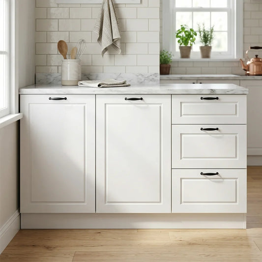 White kitchen cabinetry with a marble-look countertop, set in a bright kitchen with white subway tile backsplash, light wood floors, and window decor