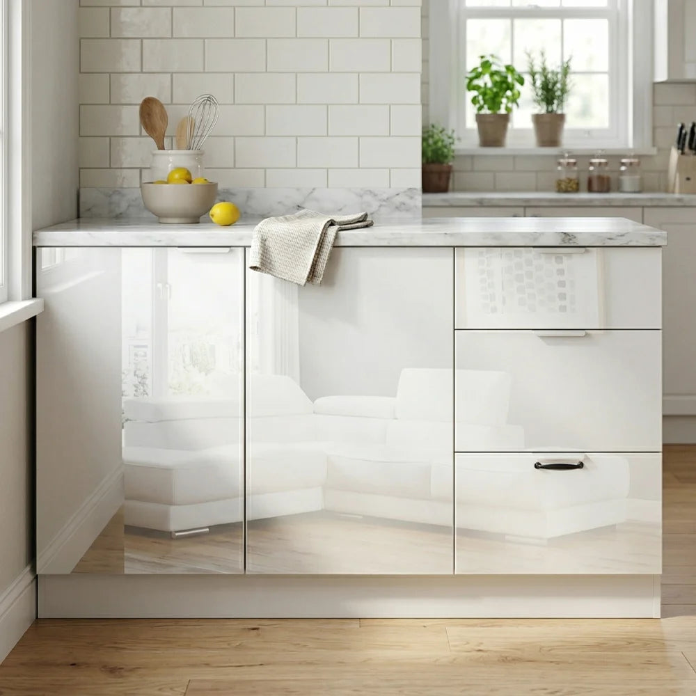A modern kitchen cabinet island in glossy white with a marble-look countertop, set against a white subway tile backsplash and light wood flooring.