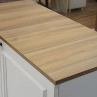 Wooden countertop on a kitchen island with blurred background