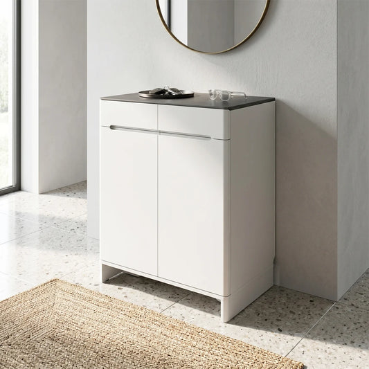 White bathroom cabinet with black countertop in a modern bathroom setting