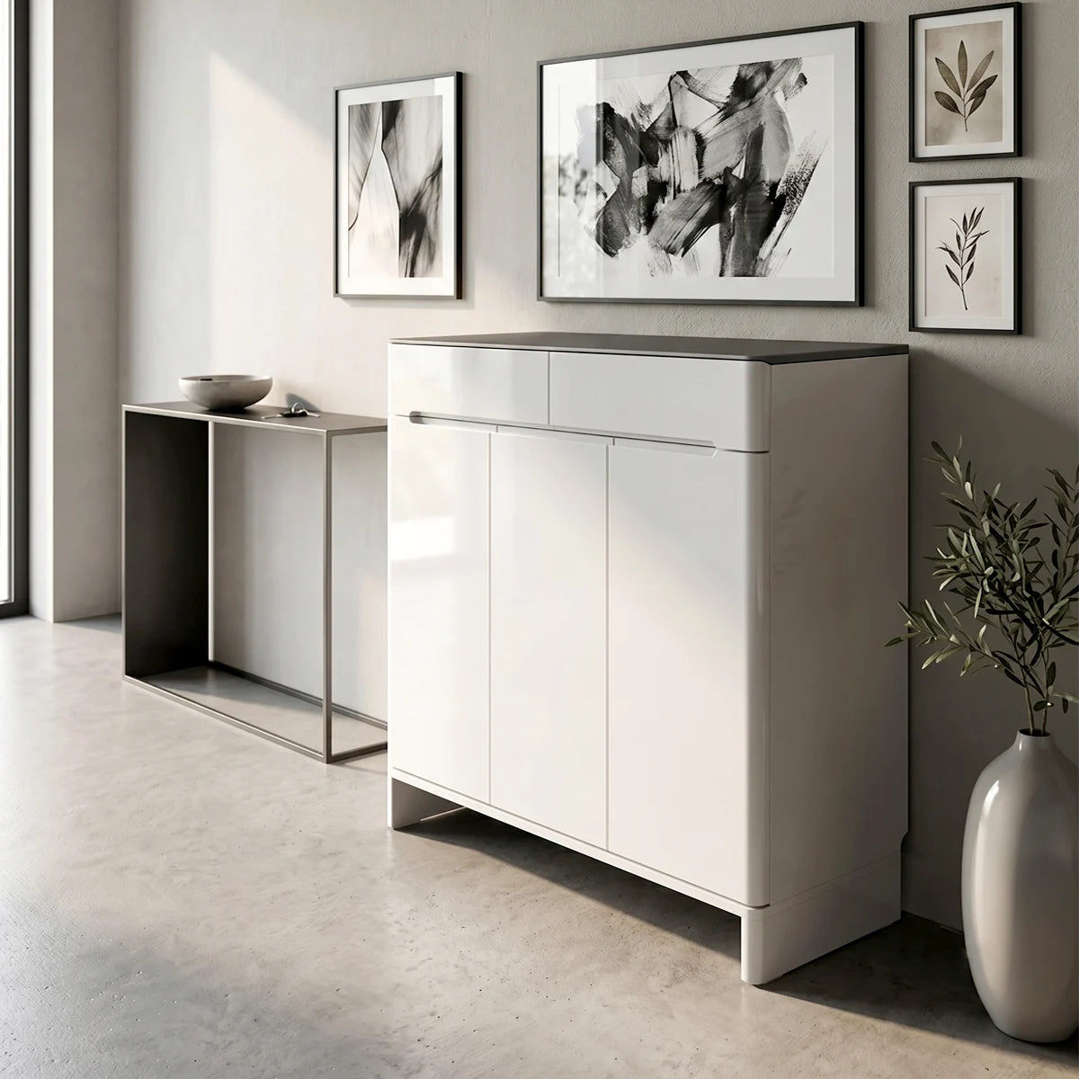 Modern interior with a white cabinet, abstract art, and decorative items