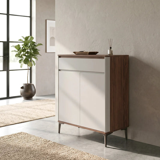 Modern sideboard with wooden top and white doors in a room with a plant and rug
