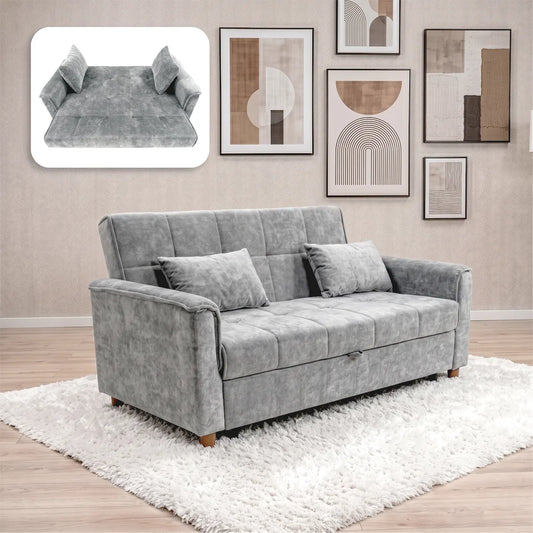 A gray upholstered loveseat sofa with two matching throw pillows, shown in a styled living room setting on a white shag rug. The image also includes a floating inset at the top left showing the sofa folded into a bed.